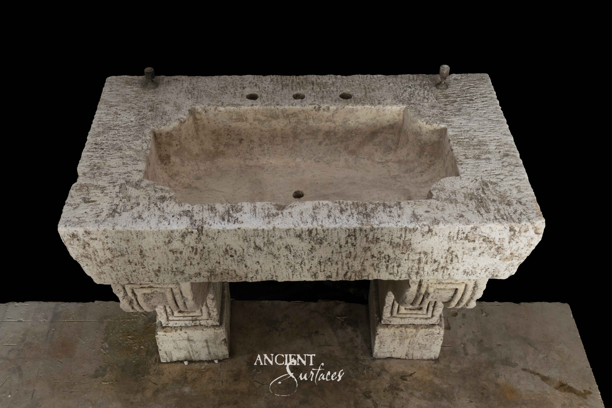 Broad mottled limestone trough sink with a deep rectangular basin, drilled rear tap ledge and two legs carved with stepped returns